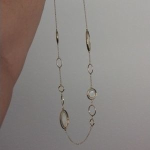 Long double sided pendant necklace with gold tones and cream